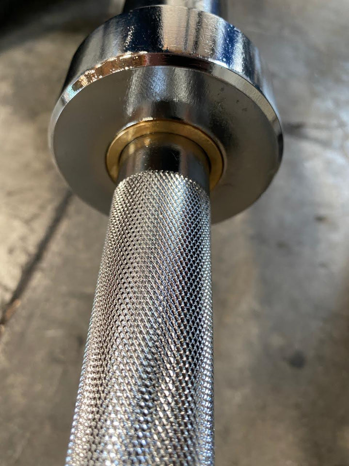 Goliath Titan Olympic Barbell – 1000LB Capacity, 7FT A3 Steel, Dual Bearings, Center Knurl, Chrome Finish + Collars