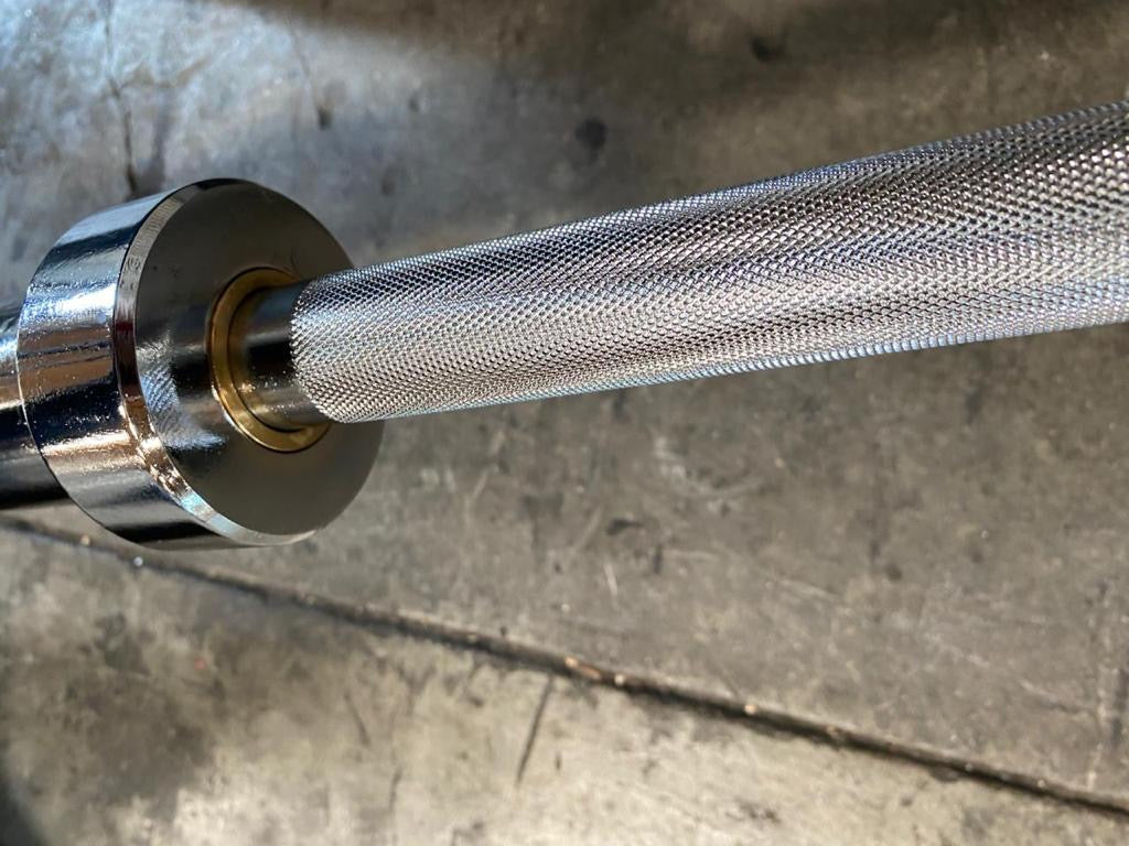 Goliath Titan Olympic Barbell – 1000LB Capacity, 7FT A3 Steel, Dual Bearings, Center Knurl, Chrome Finish + Collars