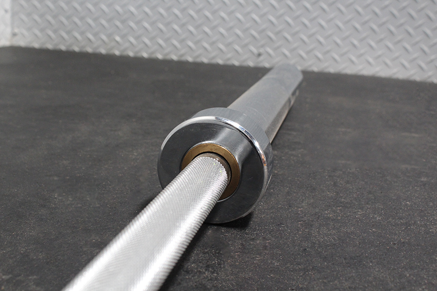 Goliath Titan Olympic Barbell – 1000LB Capacity, 7FT A3 Steel, Dual Bearings, Center Knurl, Chrome Finish + Collars